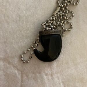 Juicy couture black tooth charm